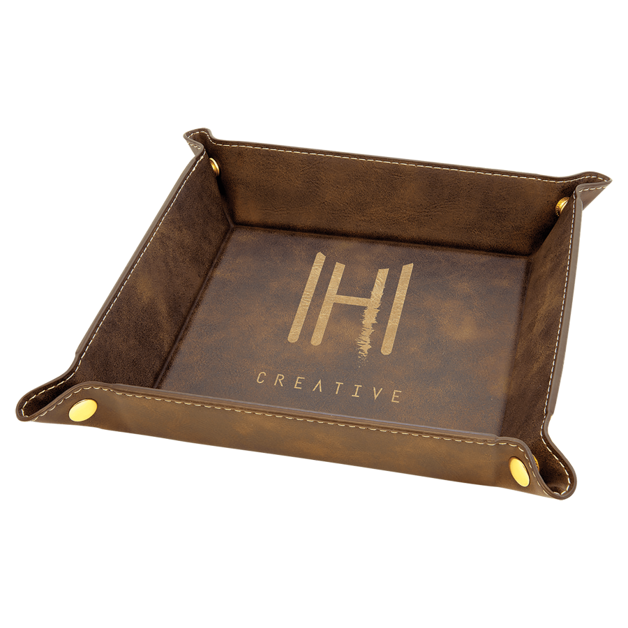 Brown leather tray with gold accents and gold engraved logo